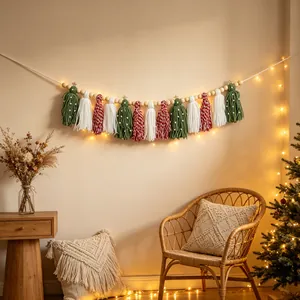 Handmade Bohemian Christmas tassel garland featuring wooden beads in a cozy room setting.