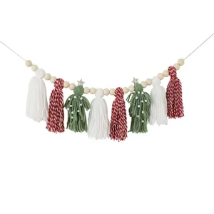 Handmade Christmas garland featuring wooden beads and festive red, white, and green yarn tassels