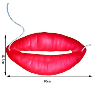 Detailed view of funny red sausage lips prop with 10cm by 5.5cm dimensions