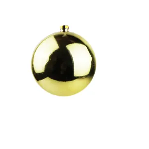Shiny golden Christmas ball ornament for tree decoration and festive holiday vibe