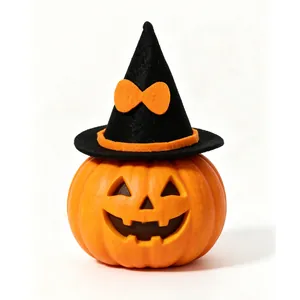 Close-up detail showing the texture of a mini felt witch hat on an orange Halloween pumpkin