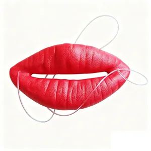 Detailed view of large red sausage lips accessory featuring textured skin and elastic.