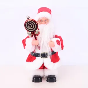Detail of an electric standing Santa Claus doll holding a red lollipop ornament
