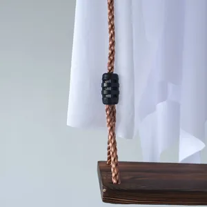Close-up detail of Halloween ghost swing with durable braided rope and wooden seat.