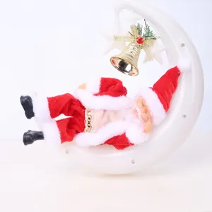 Detailed view of a Santa Claus figure lying on a white crescent moon with a gold bell