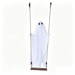 Cute white fabric ghost Halloween hanging decoration on a rustic wooden swing ornament