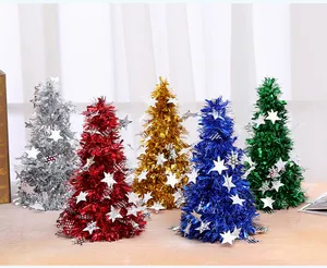 Detailed view of five colorful mini tinsel Christmas trees decorated with silver stars
