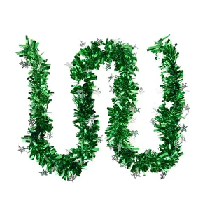 Festive green Christmas tinsel garland with silver star accents for holiday party decor