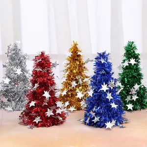 Set of five colorful mini tinsel Christmas trees with star ornaments for festive tabletop decor