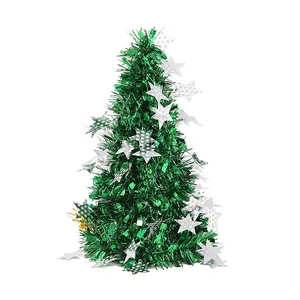 Mini green tinsel Christmas tree with silver star ornaments for holiday desk decoration