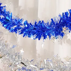Festive blue and silver Christmas tinsel garland with shiny star sequins for holiday decor