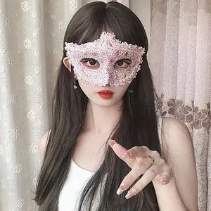 Detailed view of pink lace masquerade mask worn by a model for Halloween party events