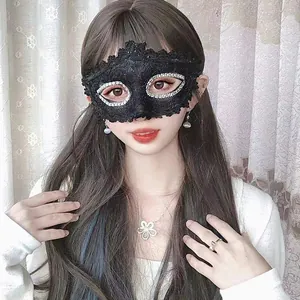 Elegant black lace masquerade half-face mask with glitter detail worn by a model for parties