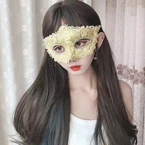 Detailed view of an elegant gold lace masquerade mask with sparkling rhinestone trim