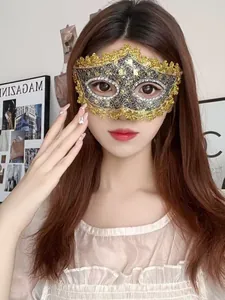 Detailed shot of an elegant golden and silver lace masquerade mask worn by a young woman