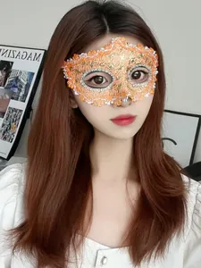 Detailed view of elegant orange lace masquerade half-face mask for costume party