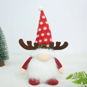 Detailed view of a plush Christmas gnome with reindeer antlers and red polka dot hat
