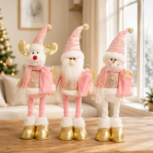 Close-up of pink and gold fabric Christmas figurines with long telescopic legs standing