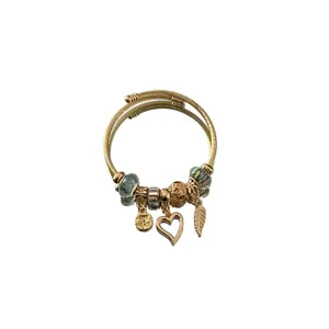 Adjustable stainless steel DIY beaded bracelet with heart and feather charms in gold