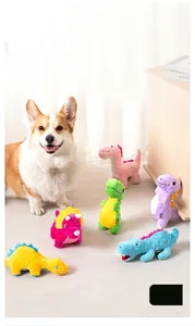 Assorted colorful plush dinosaur squeaky dog toys shown in a cozy indoor setting