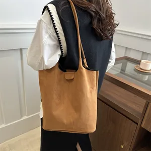 Elegant vintage brown suede tote bag for women featuring large capacity and soft straps