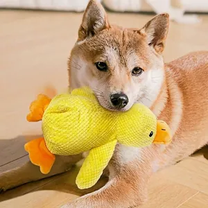 Yellow plush squeaky duck toy for dogs with durable corduroy texture for chewing