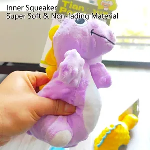 Purple dinosaur plush squeaky toy for dogs with soft texture and durable material