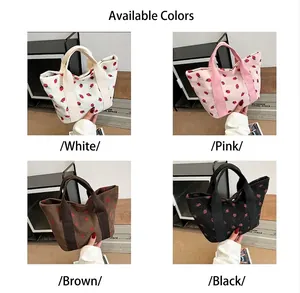 Corduroy strawberry print tote bags available in white, pink, brown, and black variants