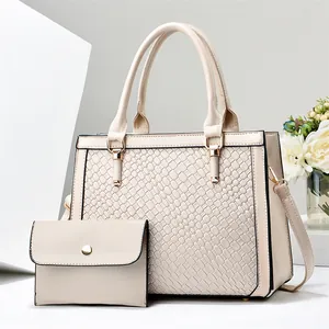 Elegant beige faux leather handbag and matching clutch set featuring luxury textured pattern