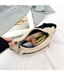Detailed view of cream plush sherpa belt bag showing ample storage for phone and makeup