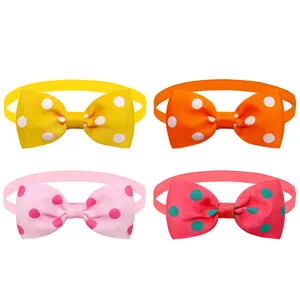 Four colorful polka dot pet bow ties for dogs and cats in yellow, orange, and pink