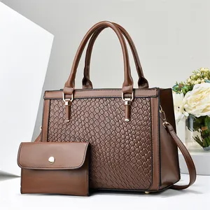 Two-piece brown handbag set with woven texture detail and matching small wallet