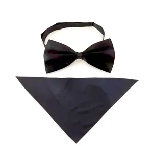 Detailed view of a classic black solid cotton pet bow tie and matching triangle scarf set