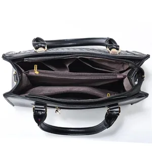 Internal view of black large capacity handbag featuring multiple organized compartments
