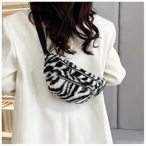 Detail view of a stylish zebra pattern plush chest bag worn over a trendy white blazer