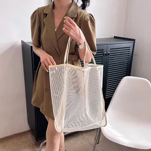 Stylish large capacity beige mesh tote bag perfect for beach travel and home storage