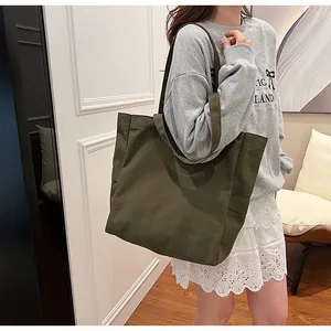 Large olive green canvas tote bag for women, minimalist shoulder shopping bag for daily use.
