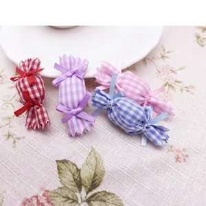 Detailed macro shot of colorful checkered mesh candy-shaped DIY hair bow accessories