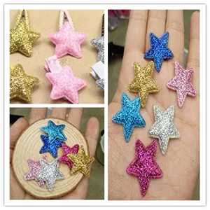 Close-up of glittery mesh star patches for DIY baby hair clips and handmade accessories