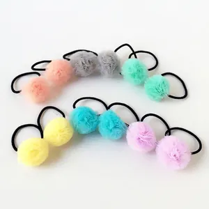 Detailed view of 2.5cm colorful mesh ball pom-poms for handmade DIY hair accessories