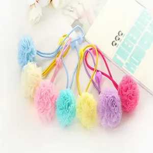 Close-up of colorful 2.5cm mesh pom-pom balls for DIY handmade hair accessories
