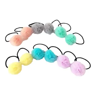Collection of colorful 2.5cm mesh pom-pom hair ties in pastel shades on white background