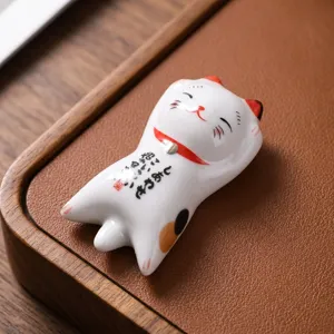 Reposapalillos de cerámica japonesa de gato de la suerte y soporte para bolígrafo