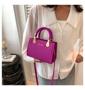 Fashionable purple handbag with braided handles and golden miss.mini logo detail