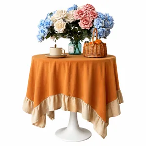 Modern round tablecloth with terracotta fabric and beige ruffled lotus leaf edges.
