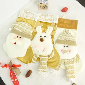 Detail of three Christmas stockings featuring Santa Claus, snowman, and reindeer designs