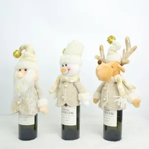 Three Christmas wine bottle covers featuring Santa, snowman, and reindeer characters.