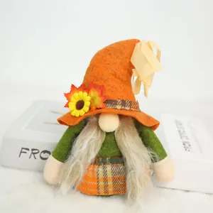 Detailed view of Thanksgiving faceless gnome with orange plaid hat and sunflower