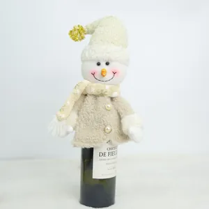 Plush snowman wine bottle cover with scarf and hat detail for Christmas holiday table