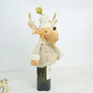 Festive plush reindeer wine bottle cover featuring gold antlers and a cream fleece jacket